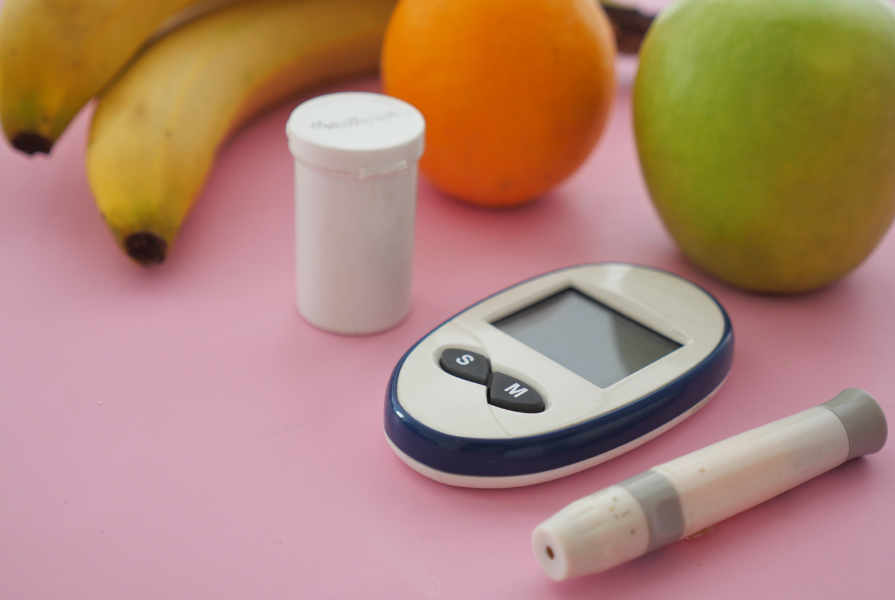 various fruits and blood glucose monitor 